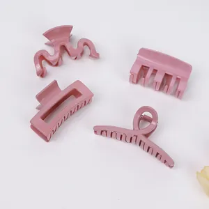 Pink matte shark hair clips set with four distinct shapes for versatile styling