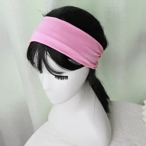 Pink elastic sports headband shown on a model head for fit and width details