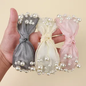 Three knotted pearl headbands in grey, beige and pink organza fabric for women