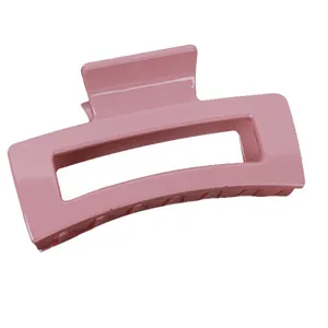 Pink minimalist rectangular hair claw clip with glossy finish for elegant updo hairstyles