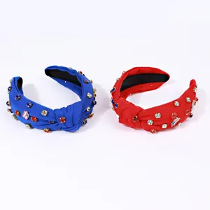 Detail of knotted headbands with colorful rhinestones and American flag patches