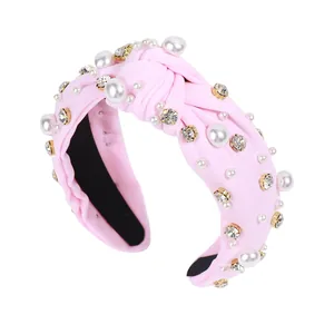 Baroque style light pink knotted headband with white pearls and sparkling rhinestones