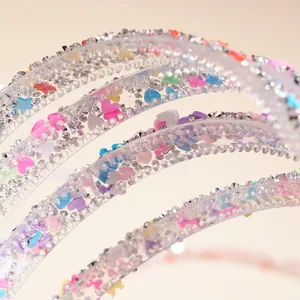 Sparkly kids headband with colorful sequin hearts and stars on silver rhinestone base