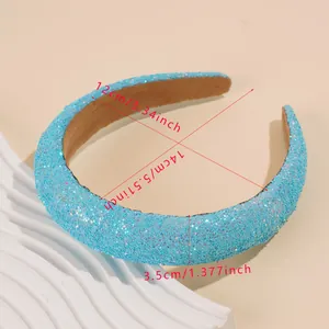 Detail view of 3.5cm sky blue glitter headband with anti-slip brown lining and size markers