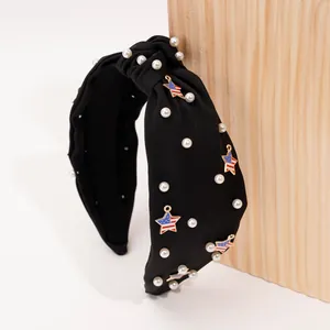 Detail of wide knot headband with white pearls and American flag star pendants