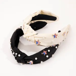 Detail of fabric knotted headbands with pearls and star-shaped American flag charms