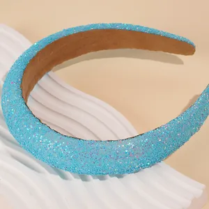 Close-up of wide sponge headband with light blue sequins and soft non-slip inner lining