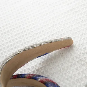 Detailed view of luxury sponge headband with red, white and blue rhinestones