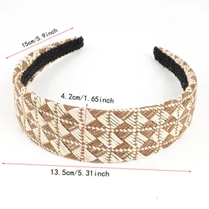 Detailed dimensions of wide woven raffia headband with brown and beige patterns