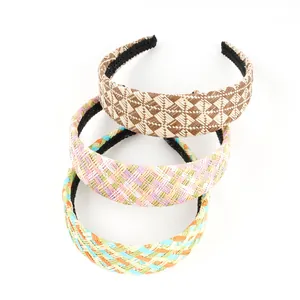 Detailed texture of three colorful checkered raffia woven wide headbands for women