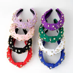 Top knot headbands with sparkling rhinestones in eight colors including pink and green