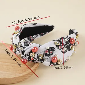Detail of Halloween knotted headband with skull print, pearls and rhinestones 17cm
