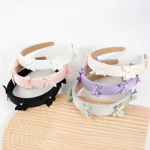 Diadema acolchada con mariposas de tela y perlas en seis colores pastel