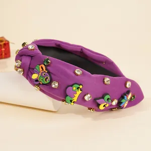 Cerchietto viola a nodo Mardi Gras con toppe maschera di carnevale e strass scintillanti