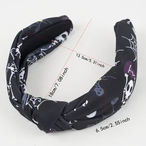 Detailed view of Halloween headband featuring skull prints and dimensions for party use