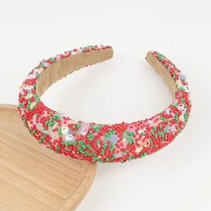 Detail of colorful beads and sequin smiley faces on a padded fashion headband