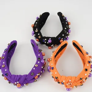 Knotted Halloween headbands with colorful pearls and rhinestones in black, purple, and orange