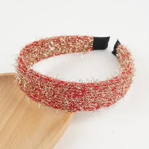Close-up of red and gold glitter tinsel headband with anti-slip black fabric ends