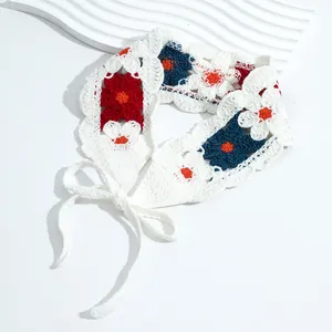 Detail of handmade crochet floral bandana featuring colorful patterns and knit texture