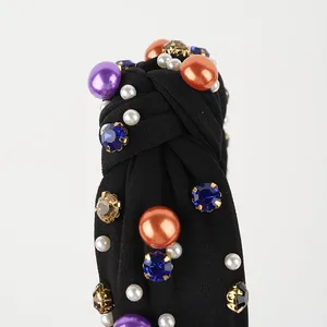 Detail of Halloween knotted headband with colorful rhinestones and faux pearls
