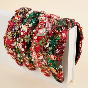 Close-up of Christmas headbands with plaid fabric, pearls, rhinestones, and Santa charms