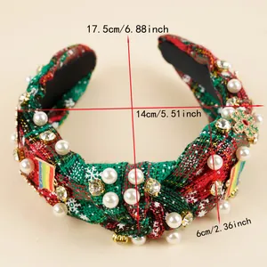 Detail of Christmas headband showing knotted fabric with rhinestones and white pearls