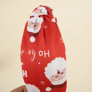 Serre-tête de Noël rouge noué avec motifs de Père Noël et flocons de neige