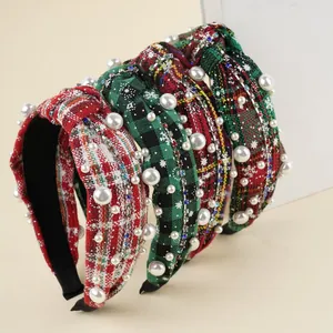 Detail of Christmas headbands with festive plaid patterns, pearls, and sparkling rhinestones