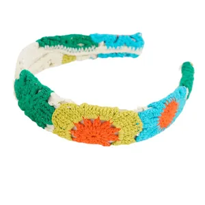 Handmade crochet floral headband with colorful knit sunflowers in bohemian vacation style