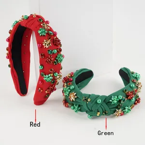 Detail of red and green knotted fabric headbands with faux pearls and star ornaments