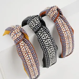 Three-piece set of bohemian woven knot headbands with retro geometric embroidery patterns