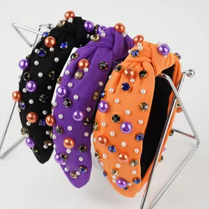 Halloween knotted headbands with colorful pearls and sparkling rhinestones on display
