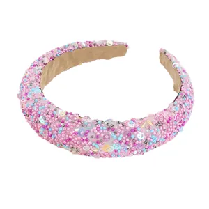 Pink beaded sponge headband with colorful smiley face sequins and non-slip velvet lining