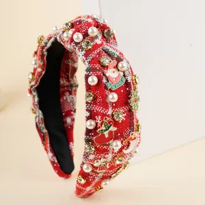 Close-up of red plaid tweed headband with pearls, rhinestones and Xmas charms