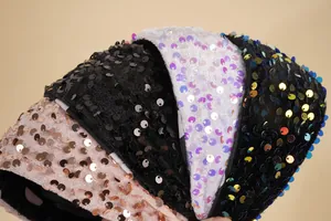 Detailed view of sequin headbands in multiple colors featuring premium velvet lining