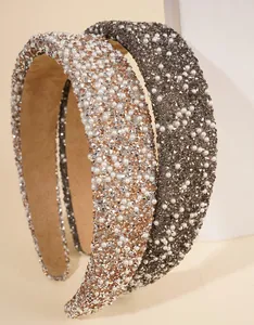 Close-up of luxury padded headband with sparkling rhinestones and white pearls detail