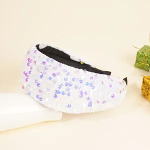 Close-up of iridescent sequins on a white velvet wide headband with non-slip lining