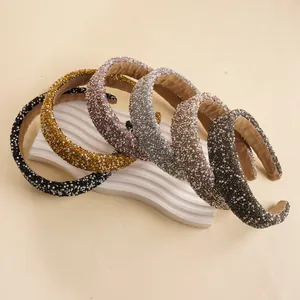 Detail of padded headbands with shimmering rhinestones, pearls and soft velvet lining