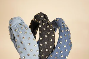 Close-up of denim knotted headbands with rhinestones in light blue, black and dark blue