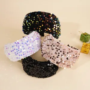 Detail of wide sequin headbands in black, multi, white, and champagne velvet styles