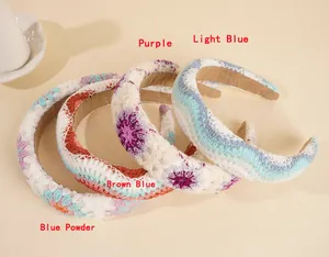 Detail of four colorful crocheted headbands with sponge padding and anti-slip lining