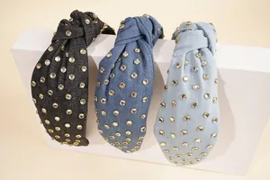 Detailed view of denim knotted headbands with sparkling rhinestones in three blue shades