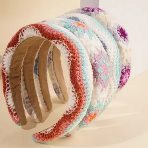 Set of four handmade crochet floral knit headbands in vibrant Bohemian gradient colors