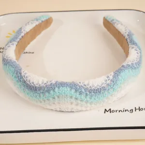 Detailed view of the wavy knit texture and multi-color stitching on this wide headband