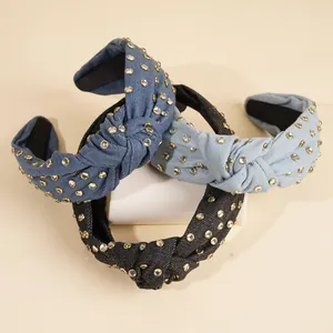 Knotted denim headband set with sparkling rhinestones in blue and black colors
