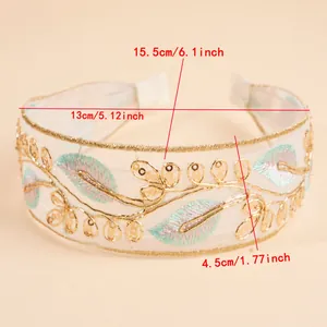 Detail view showing dimensions of a bohemian wide headband with leaf embroidery