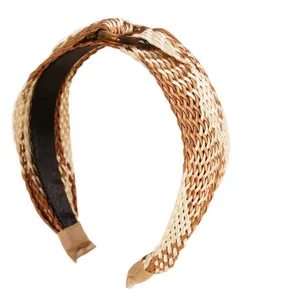 Bohemian woven cross headband with raffia style texture and resin buckle detail