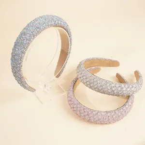 Detail of luxury rhinestone padded headbands in light blue, pink and silver white colors
