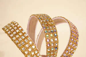 Detail of wide headband featuring four rows of sparkling rhinestones and non-slip lining