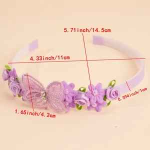 Detail showing purple floral decorations and lace butterfly on a sweet girl headband
